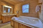 Upstairs Bathroom offers a large jetted tub, and shower stall 